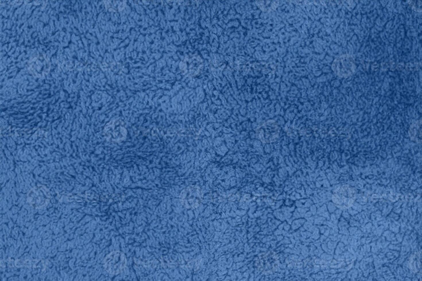 Blue sherpa textured plush fabric material background photo