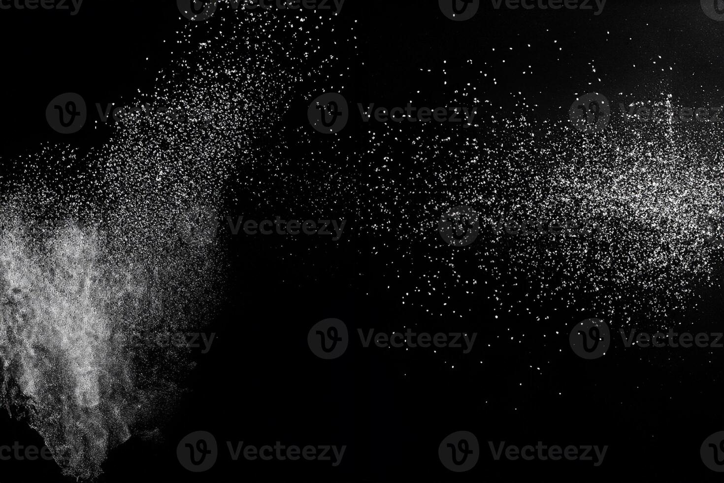 White powder explosion cloud against black background.White dust particles splash. photo