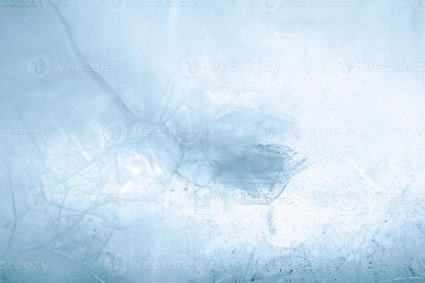 Cracked blue ice texture background photo