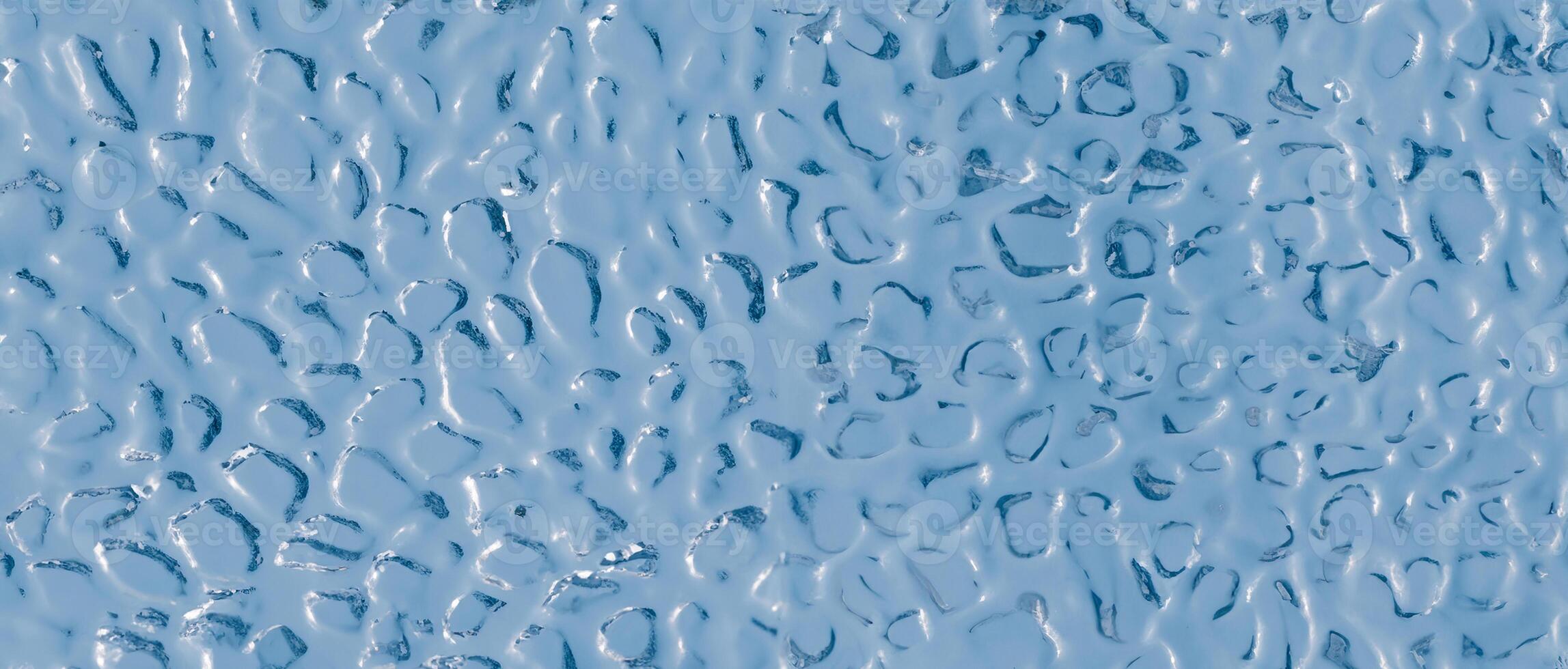 Background of uneven convex glass texture with ripple effect, water or ice imitation. photo
