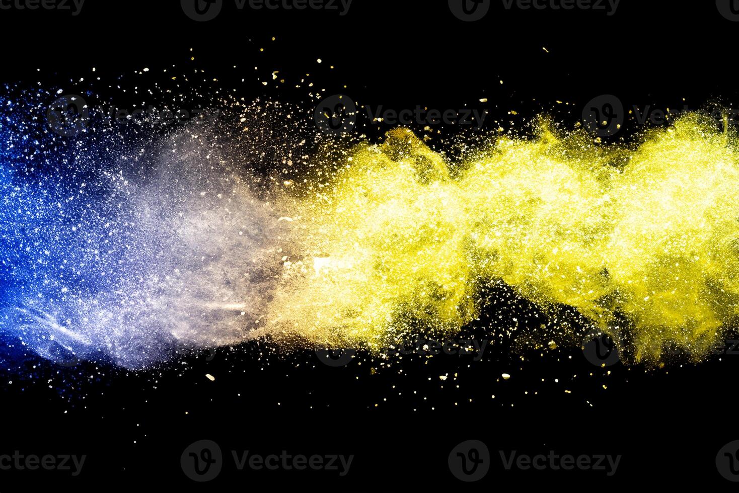 Explosion of multicolored dust on black background. photo