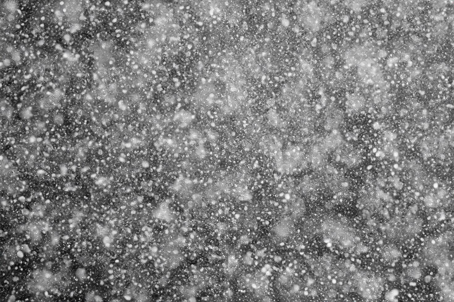 Snowflakes against black background for adding falling snow texture into your project. Add this picture as Screen mode layer in photo editor to add falling snow to any image.