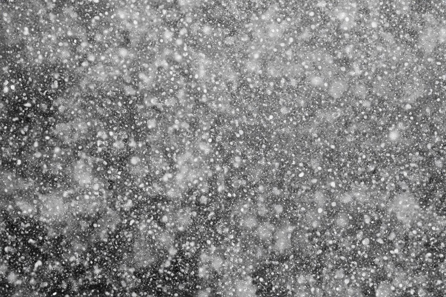 Snowflakes against black background for adding falling snow texture into your project. Add this picture as Screen mode layer in photo editor to add falling snow to any image.