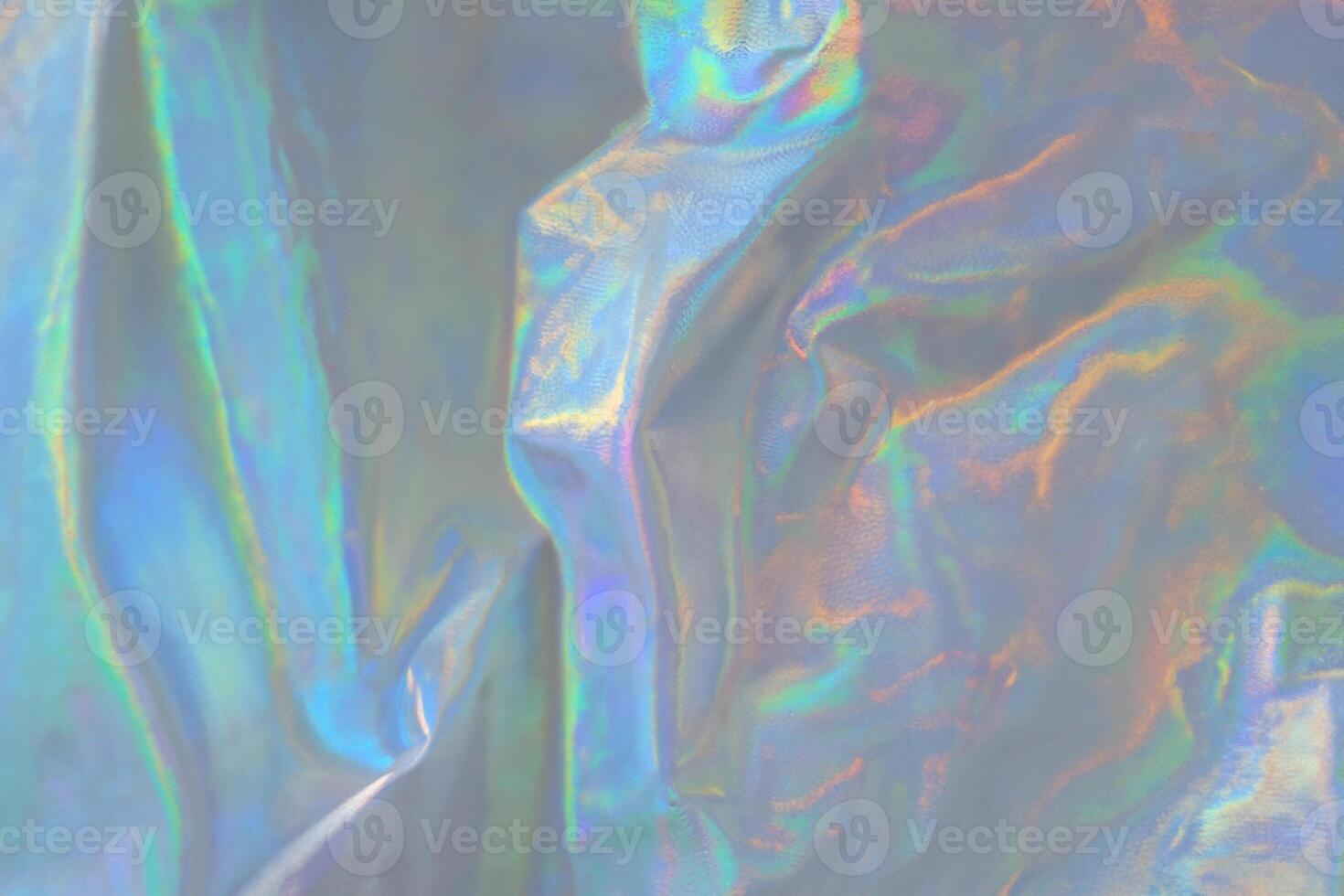 trendy holographic background.Silver metallic iridescent background.pastel colored  holographic texture in pink violet, Silver and  green colors.colorful chrome fabric.I photo