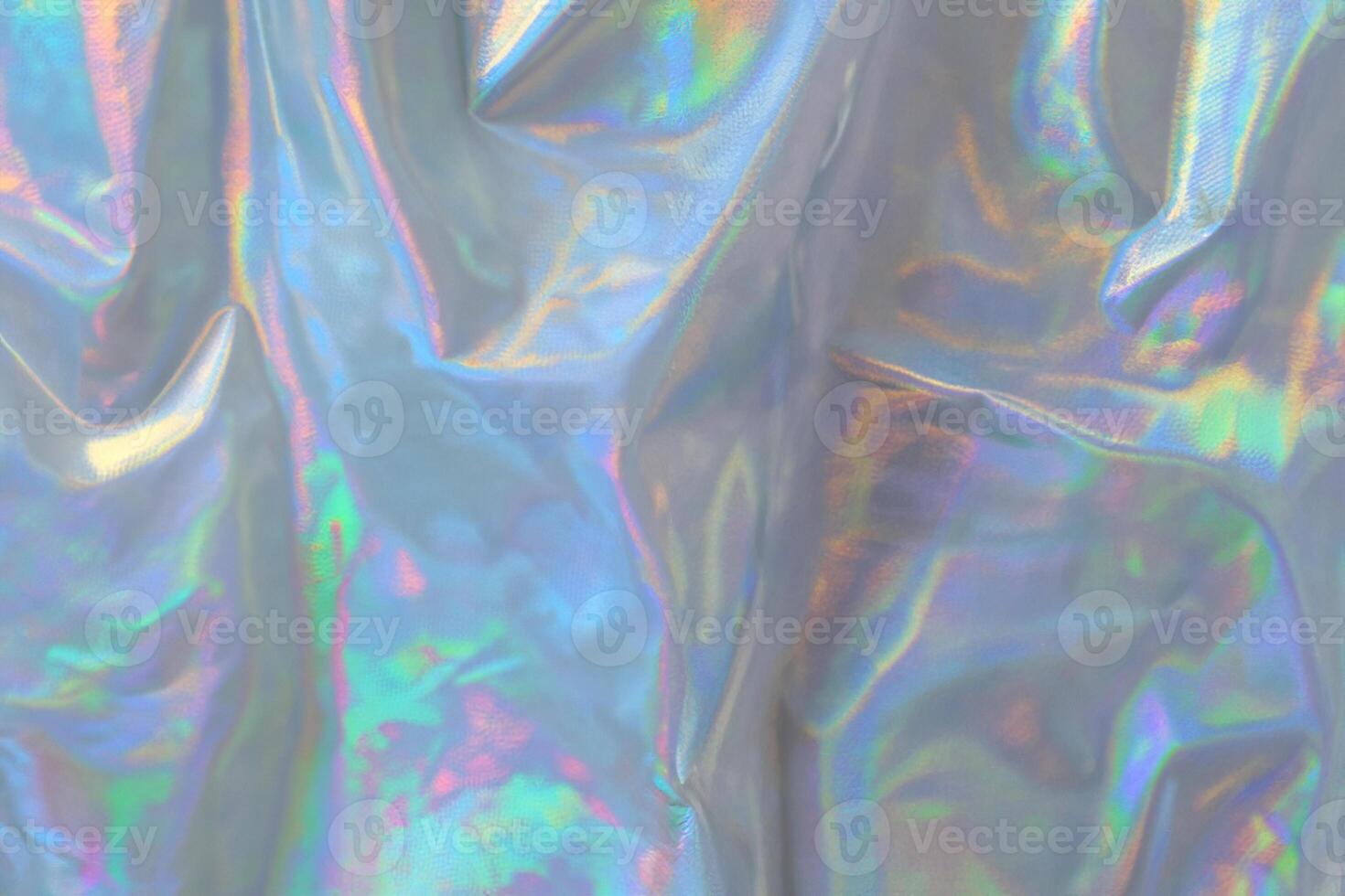 trendy holographic background.Silver metallic iridescent background.pastel colored  holographic texture in pink violet, Silver and  green colors.colorful chrome fabric.I photo