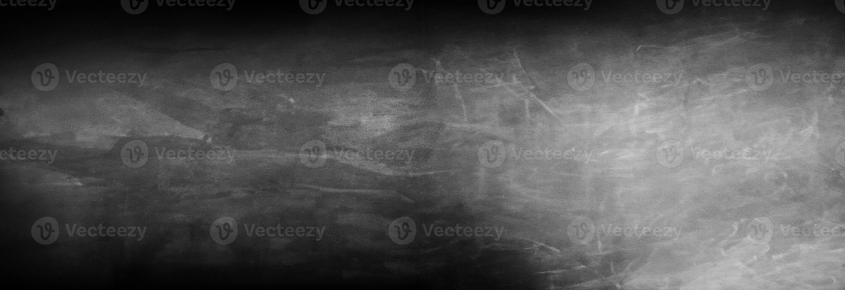 a black and white photo of a wall with some paint on it