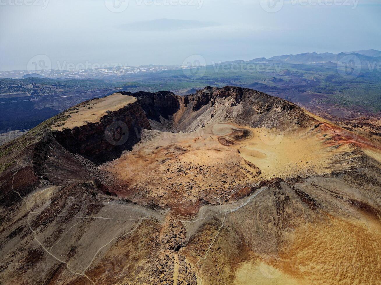 Aerial view of Pico Viejo volcano in Tenerife, Canary Islands, Spain. Pico Viejo has a spectacular 800 meters diameter crater. Famous destinations for hikers. photo