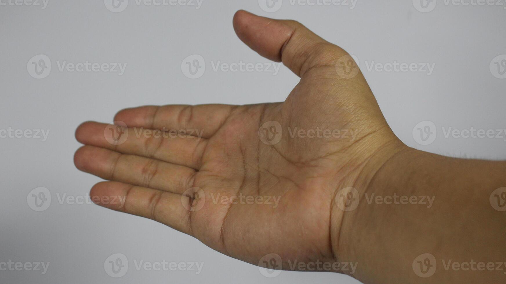 The right hand of a young man continues. Isolated on white background photo