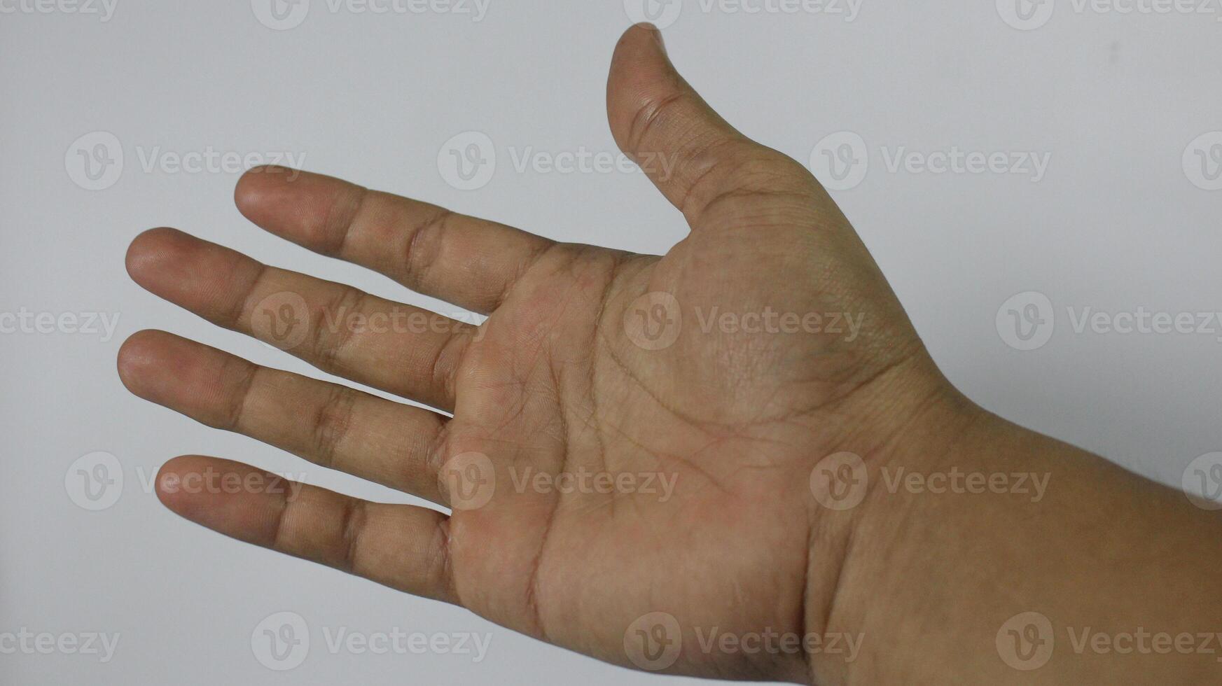 The right hand of a young man continues. Isolated on white background photo