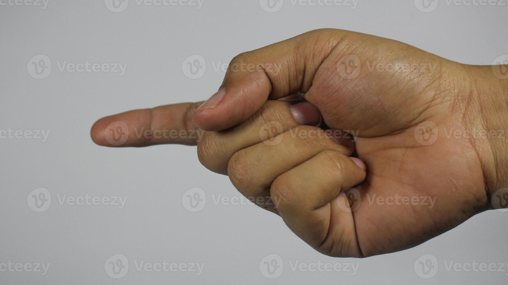 The right hand of a young man gestures with 1 finger. Isolated on white background photo