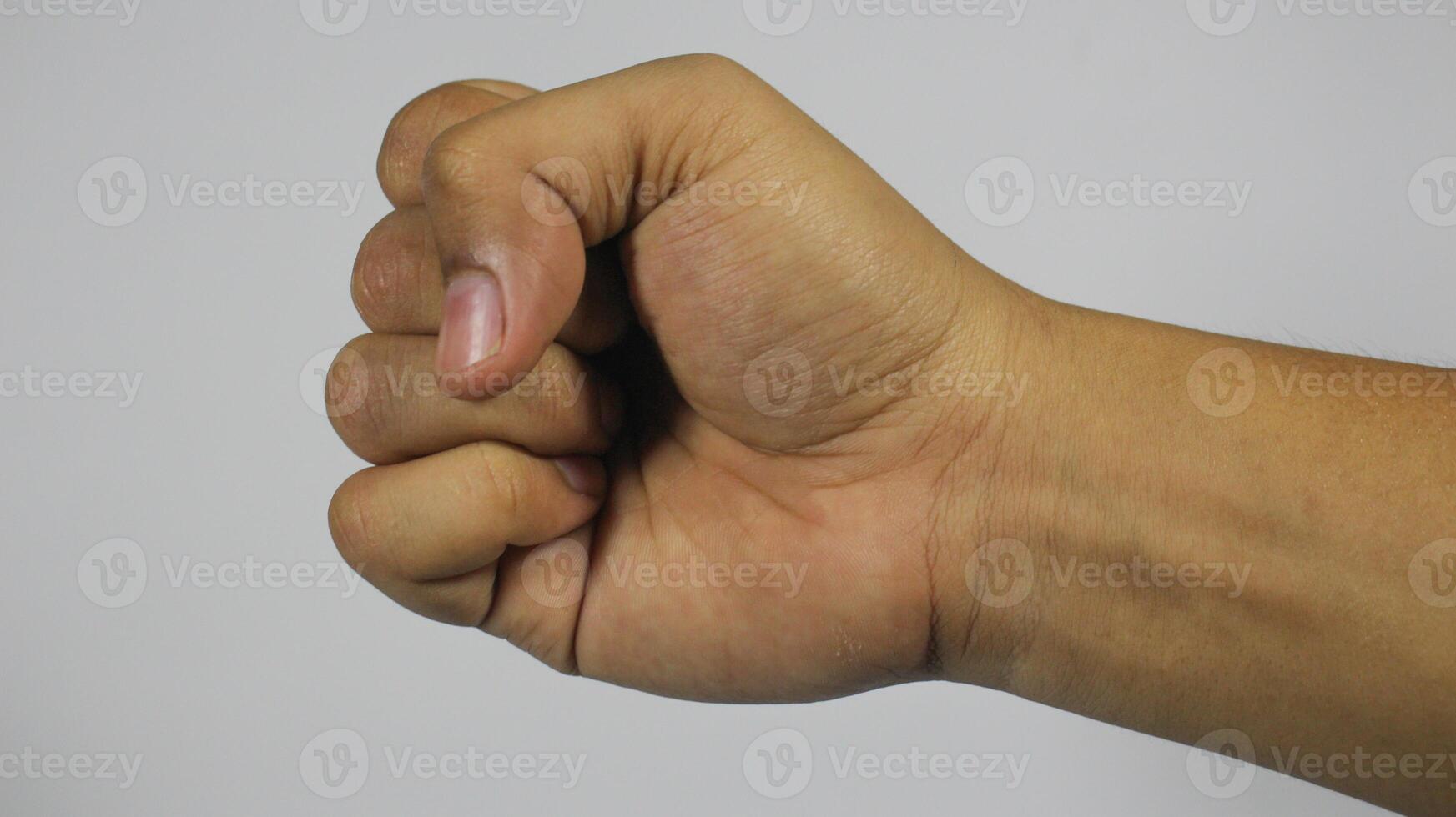 The right hand makes a clenched fist. Isolated on white background photo