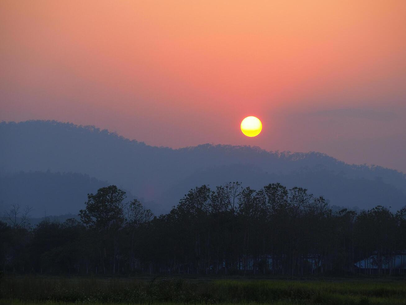 Landscape of beautiful sunset on mountain hill in Northern, Thailand photo