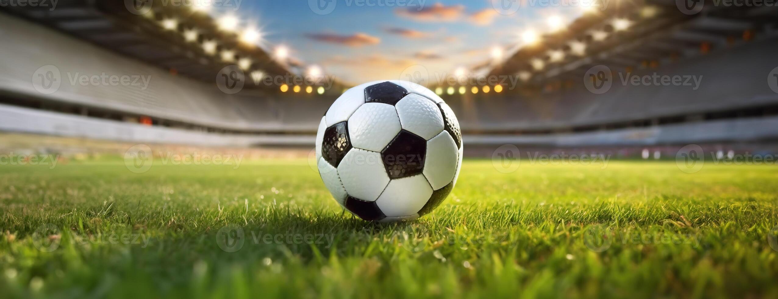 AI Generated Soccer Ball on a Lush Field with Stadium Lights Ablaze. Vibrant green grass, bathed in the floodlights glow reflects excitement of sports. Panorama with copy space. photo