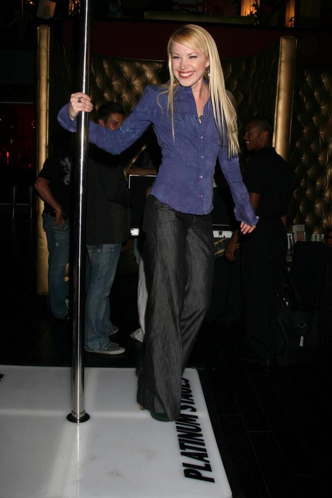 Adrienne Frantz showing off her moves on the stripper pole by Plantinum Stages GBK MTV Movie Awards Gifting Suites  Crimson  Opera Los Angeles,  CA May 30, 2008 photo