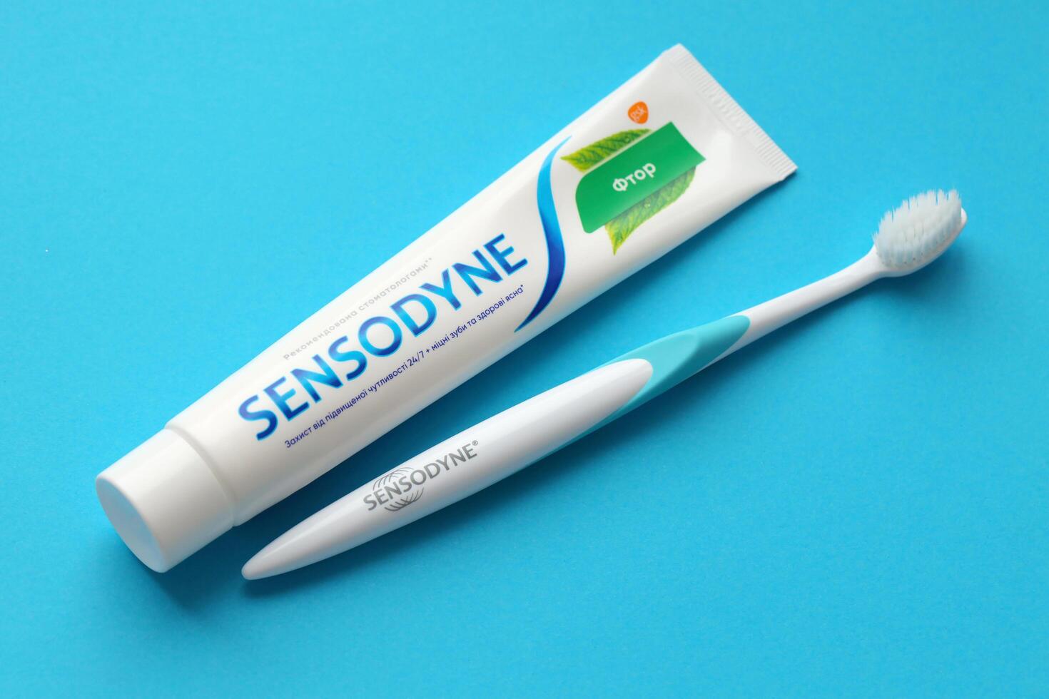 KYIV, UKRAINE - MAY 4, 2022 Sensodyne fluorine or fluor is a daily fluoride toothpaste photo