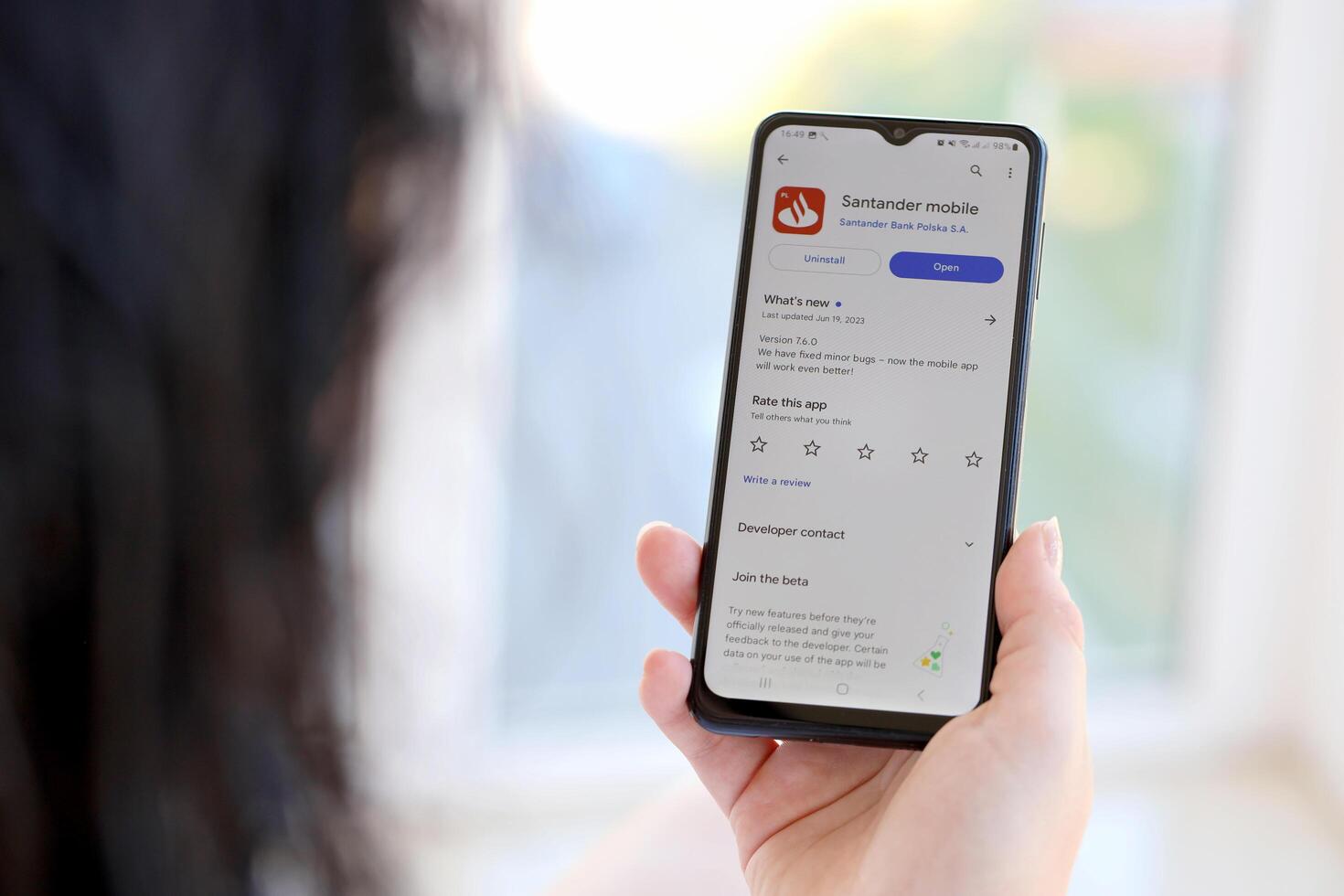 TERNOPIL, UKRAINE - AUGUST 3, 2023 Santander bank application on screen on modern smartphone. Official app of famous polish bank photo