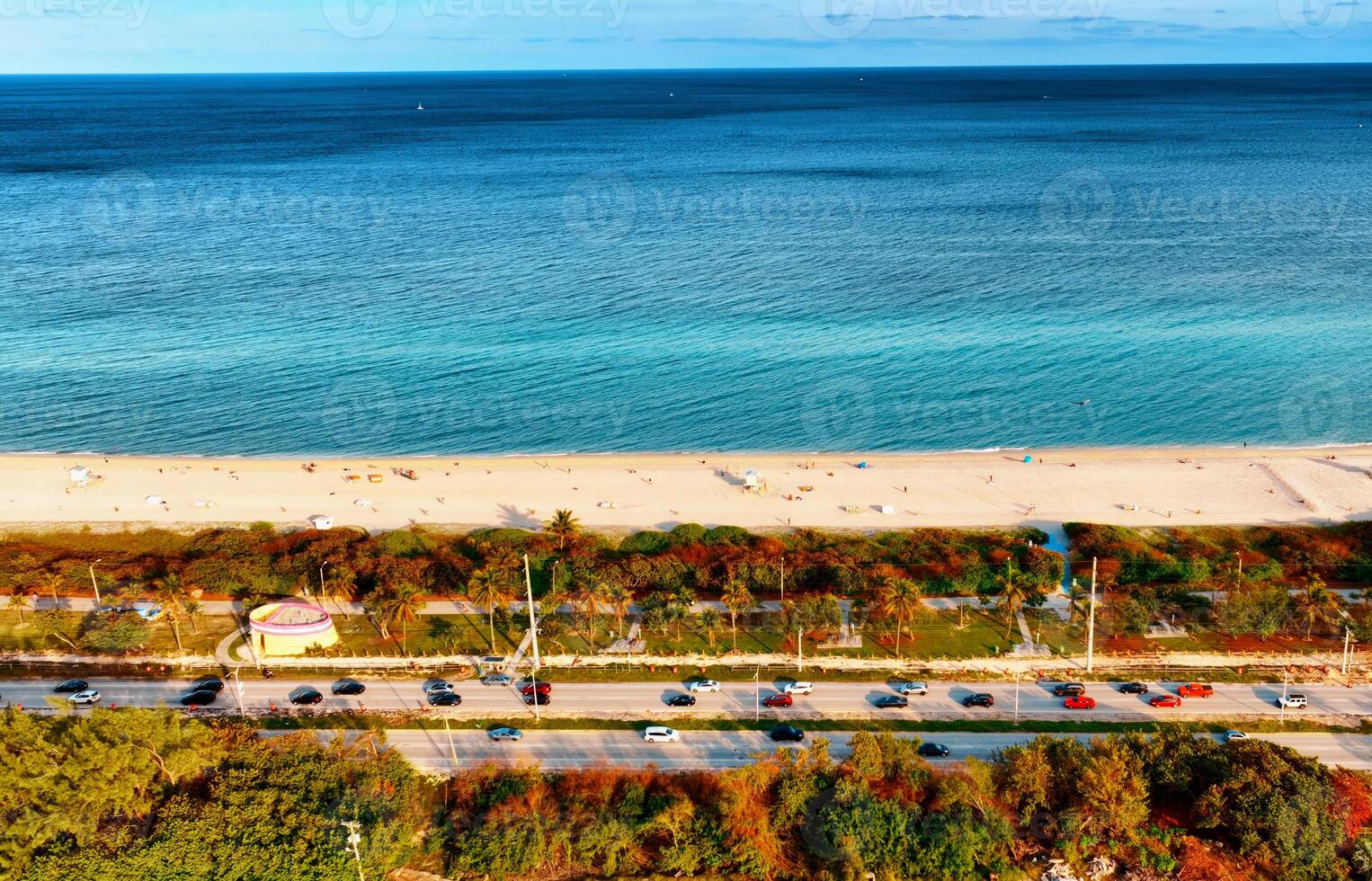 Aerial View of Miami Beach and Ocean. An expansive view of Miami Beach and the vast ocean stretching beyond it, taken from above. photo