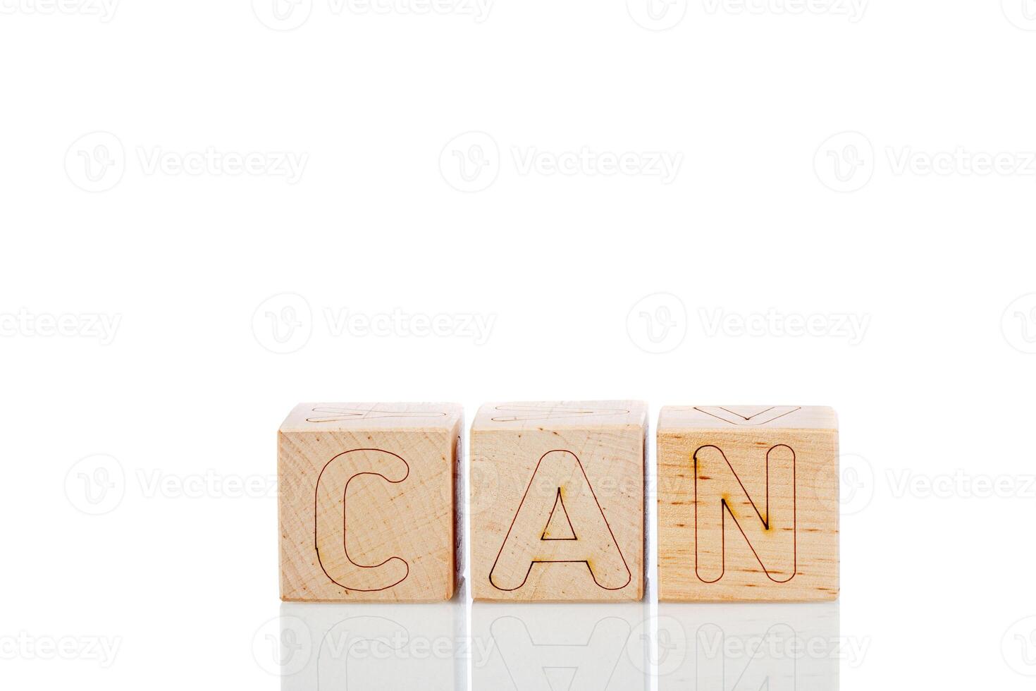 Wooden cubes with letters can on a white background photo