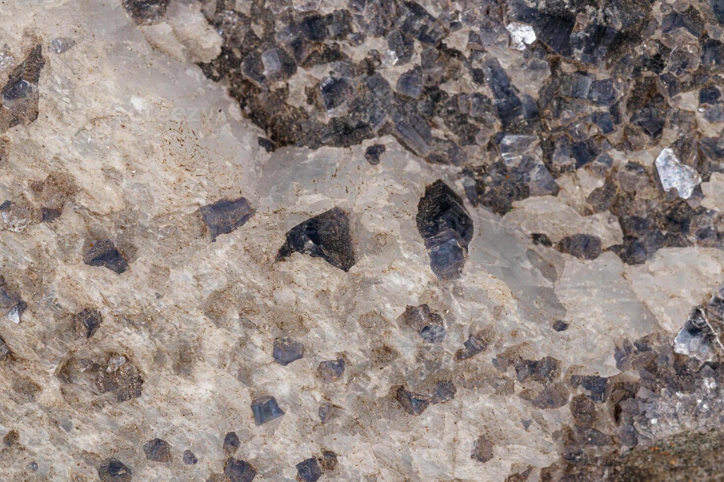 Macro stone Aegirine in charoite on white background photo