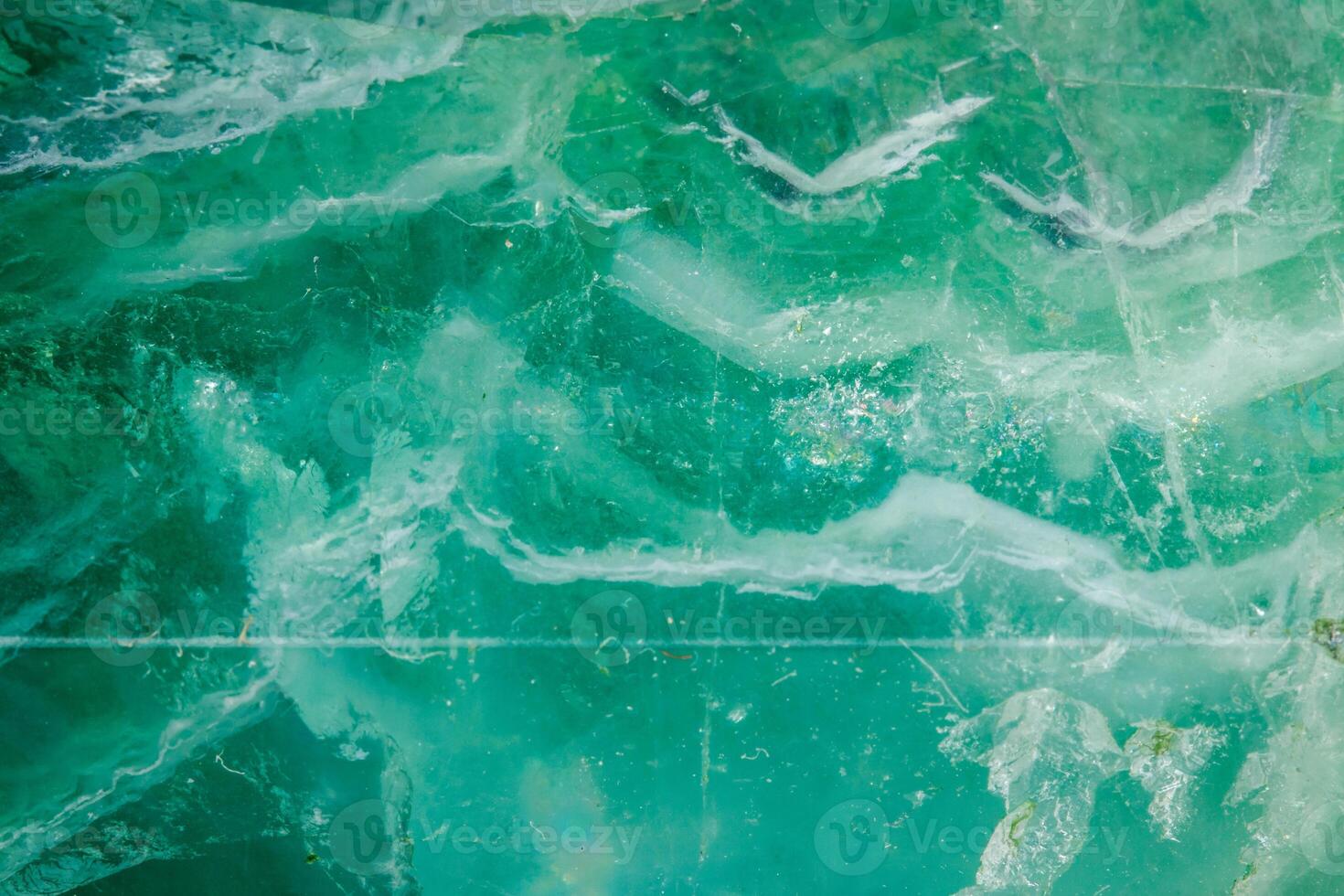 Macro mineral stone Fluorite crystal on a black background photo