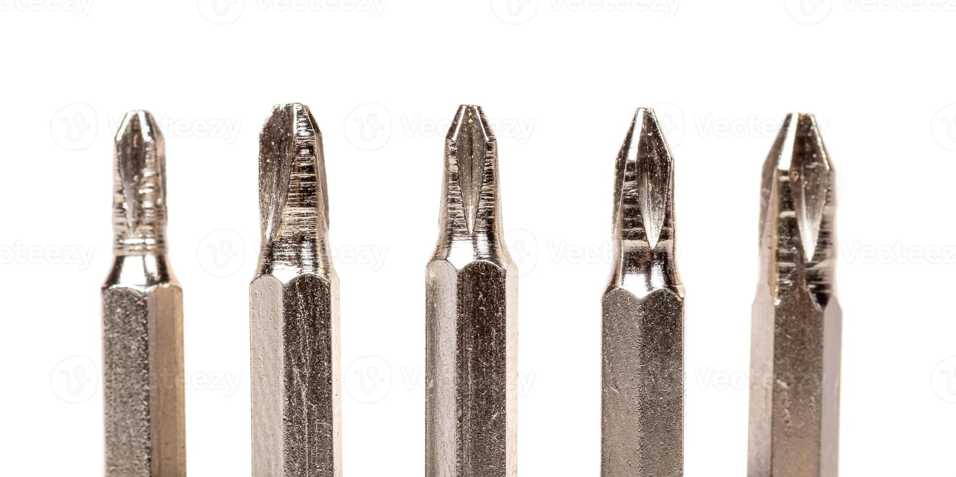 A set of different attachments for a head screwdriver with a screwdriver on a white background photo