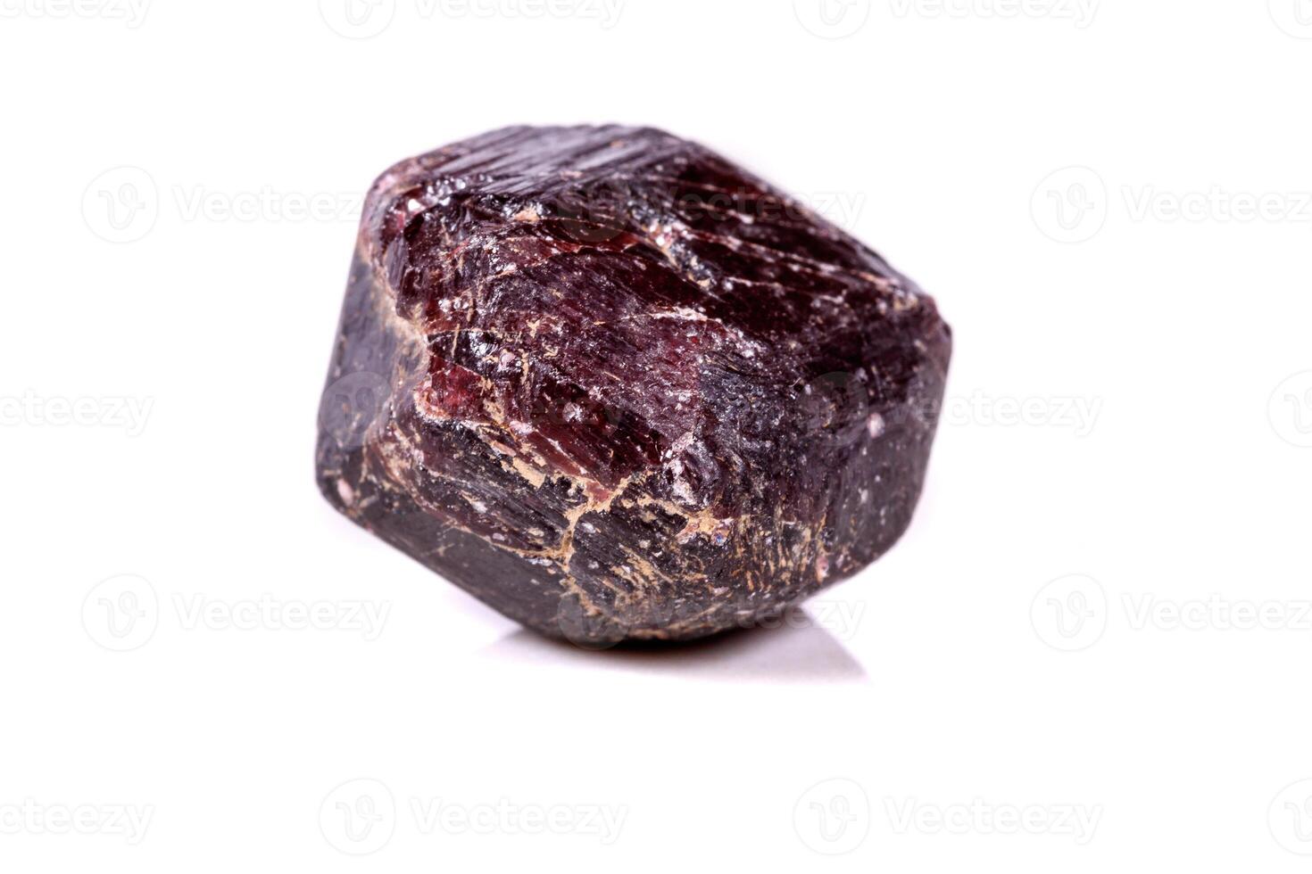 Macro of a mineral garnet stone on a white background photo