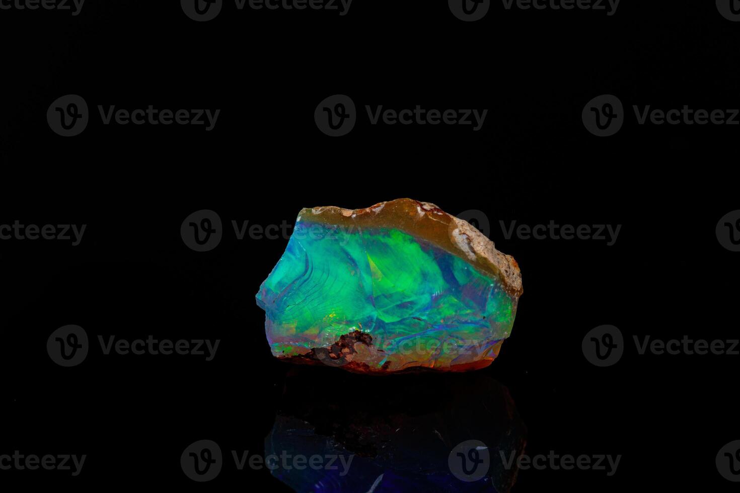 macro mineral stone rare and beautiful opals on a black background photo