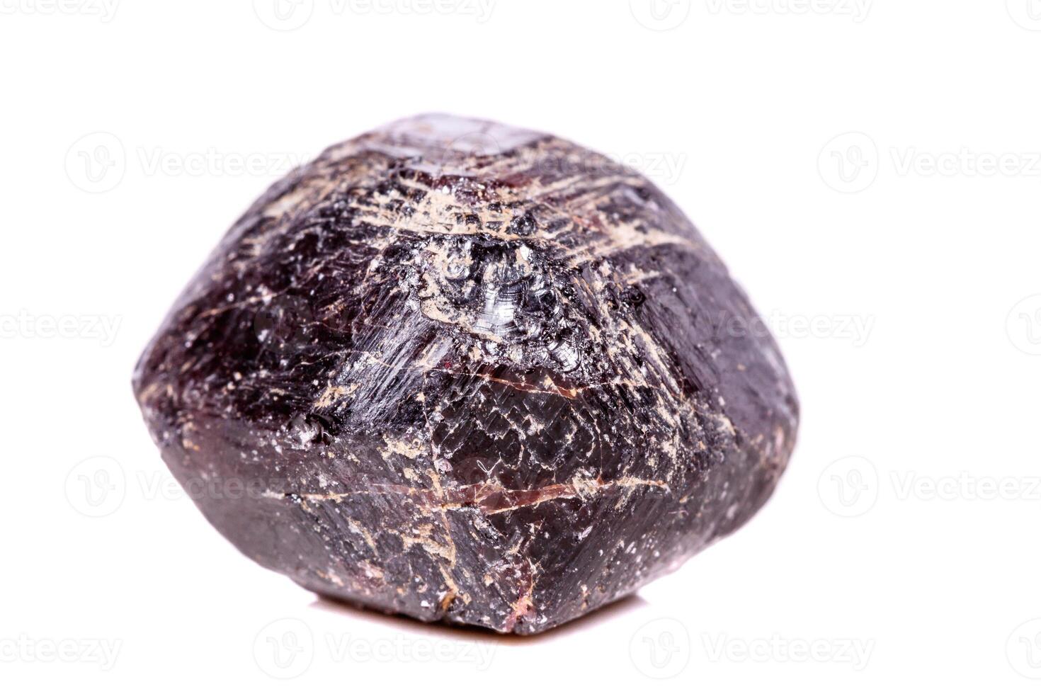 Macro of a mineral garnet stone on a white background photo