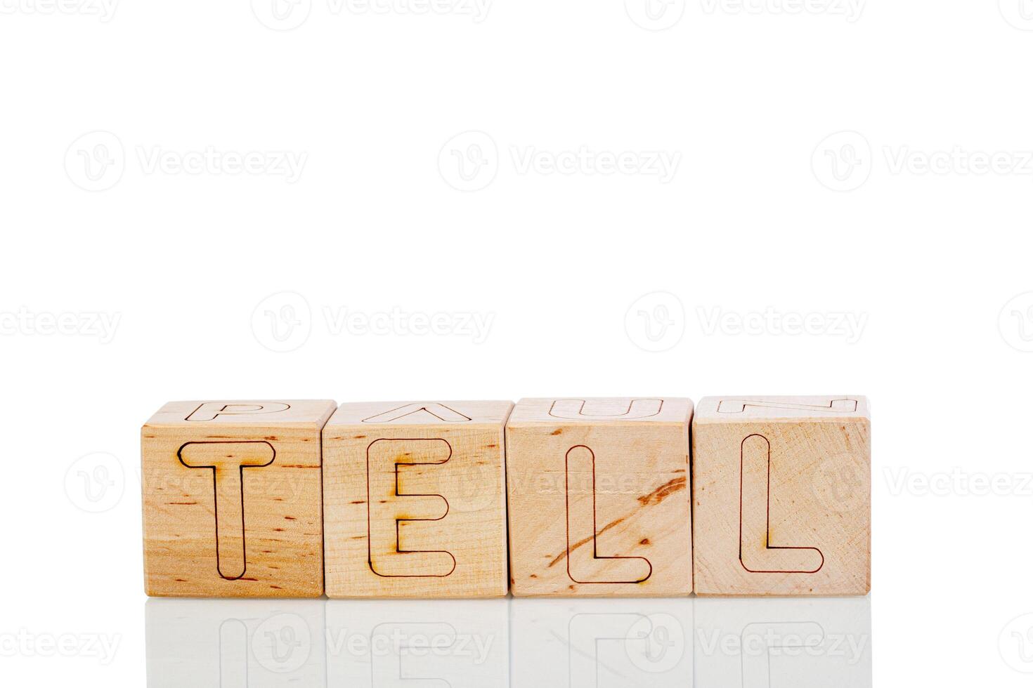 Wooden cubes with letters tell on a white background photo