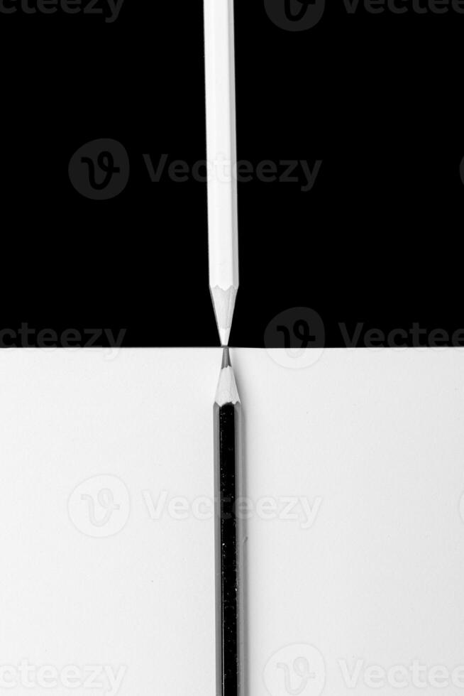 white and black pencil on white and black background photo