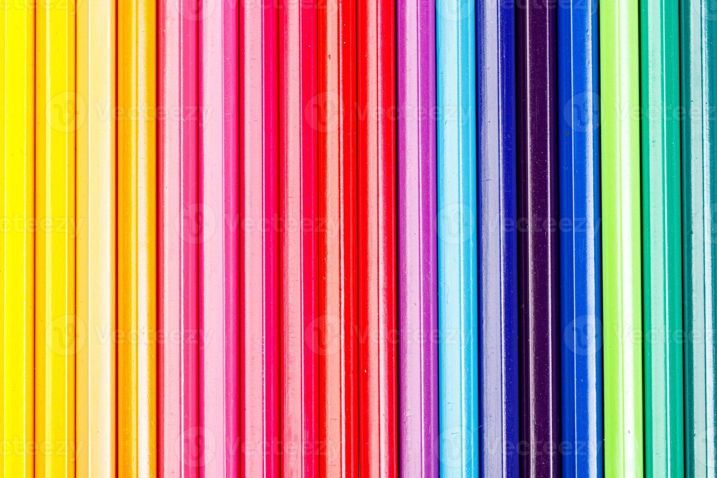 macro multicolored pencils on a white background photo