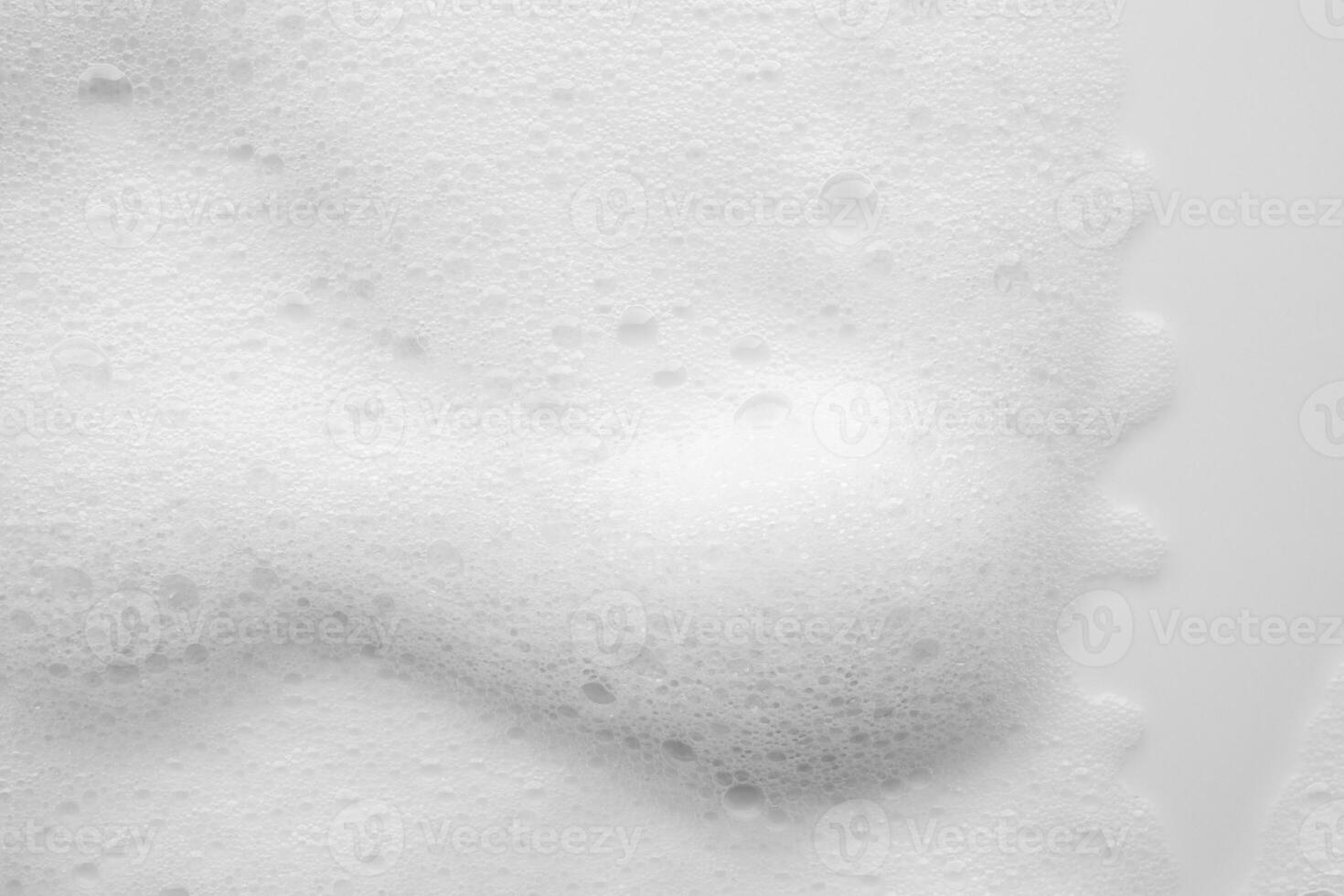 Abstract white soap foam bubbles texture on white background photo
