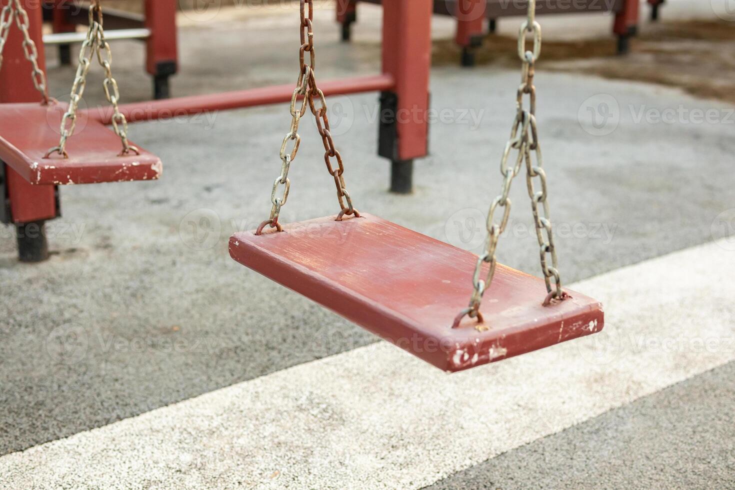 Empty chain swing in the playground photo