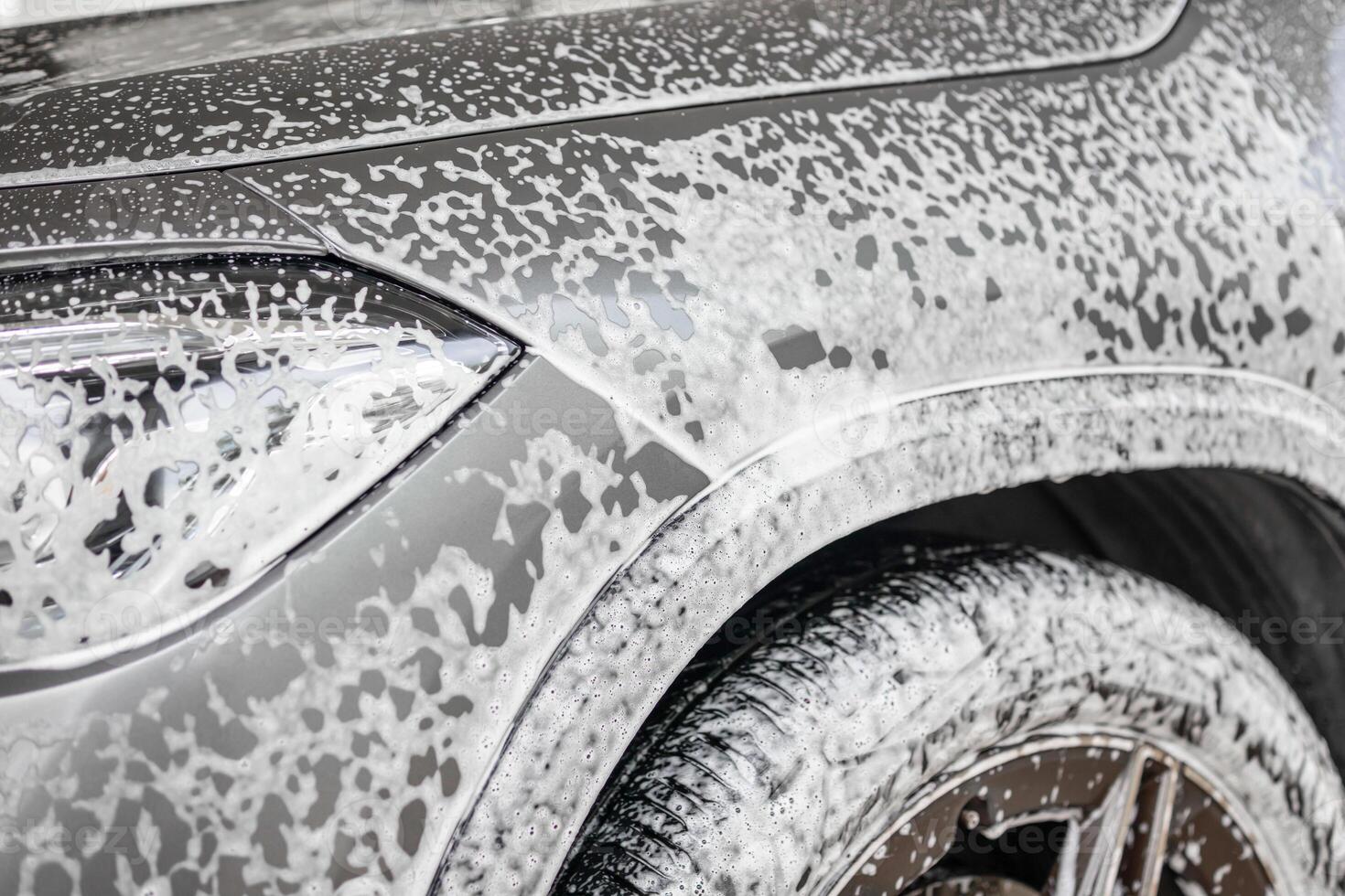 car cleaning and washing with foam soap photo