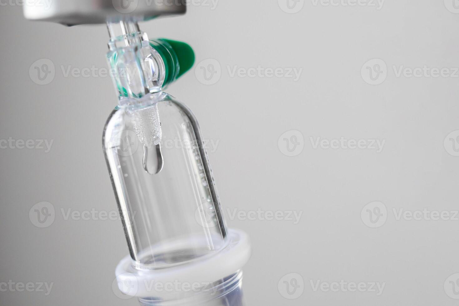 Close up medical intravenous IV drip in hospital background photo