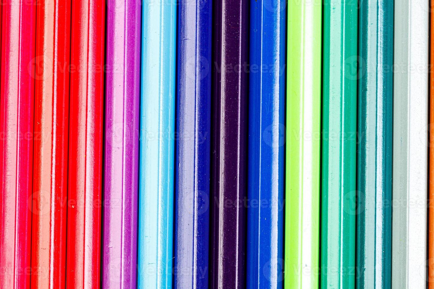macro multicolored pencils on a white background photo