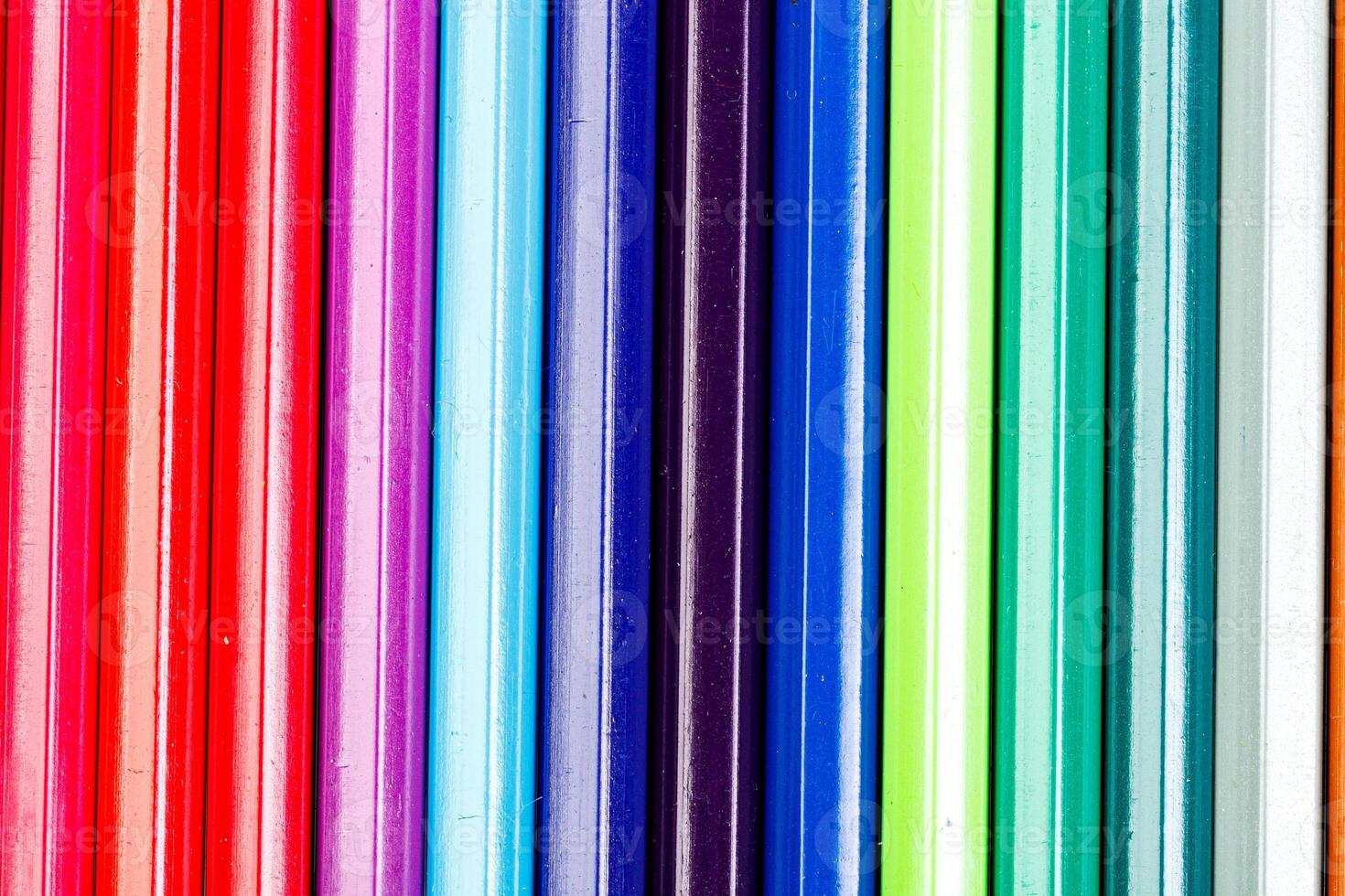 macro multicolored pencils on a white background photo