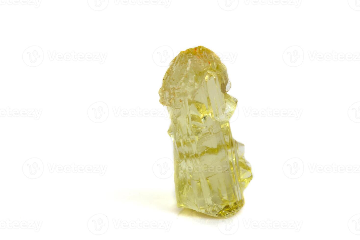 Macro mineral beryl heliodor stone on white background photo