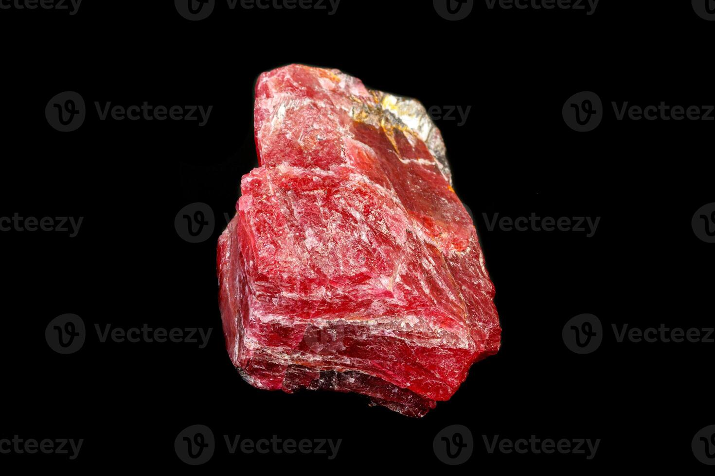 macro mineral Rhodonite stone on a black background photo