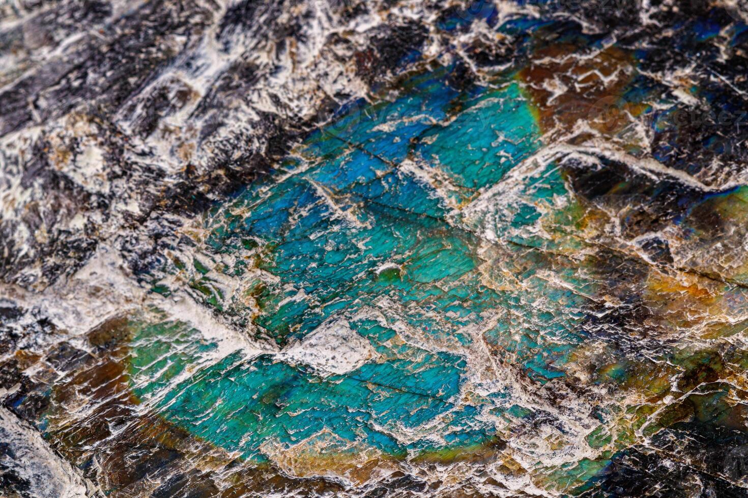 macro mineral stone labradorite on a white background photo