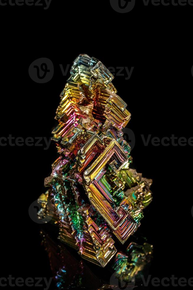 Macro of the stone bismuth mineral on a black background photo