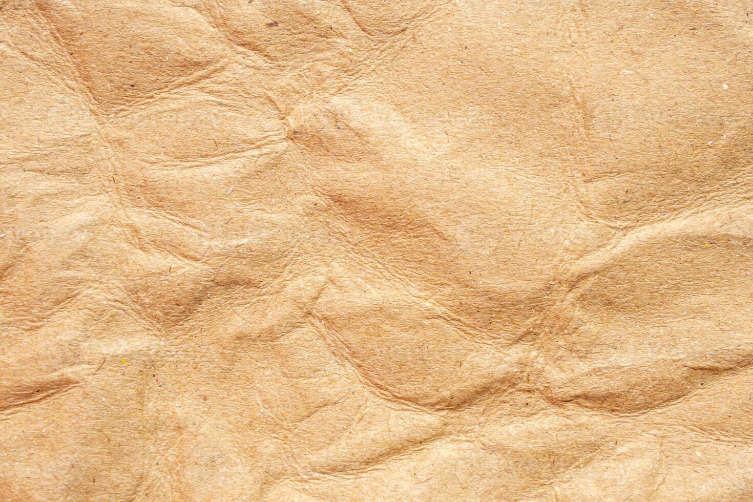 Abstract crumpled and creased recycle brown paper texture background photo