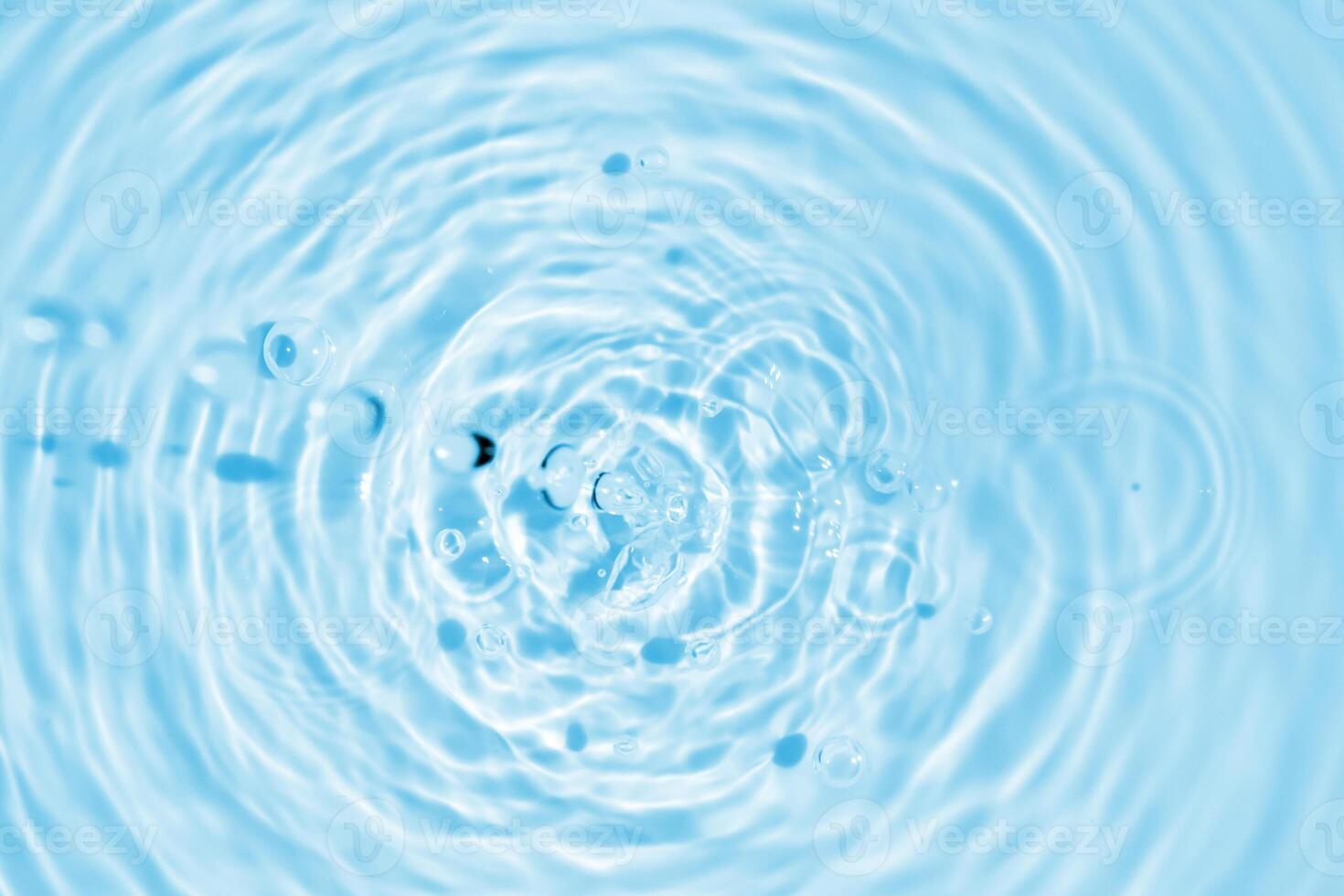 Abstract transparent water shadow surface texture natural ripple on blue background photo