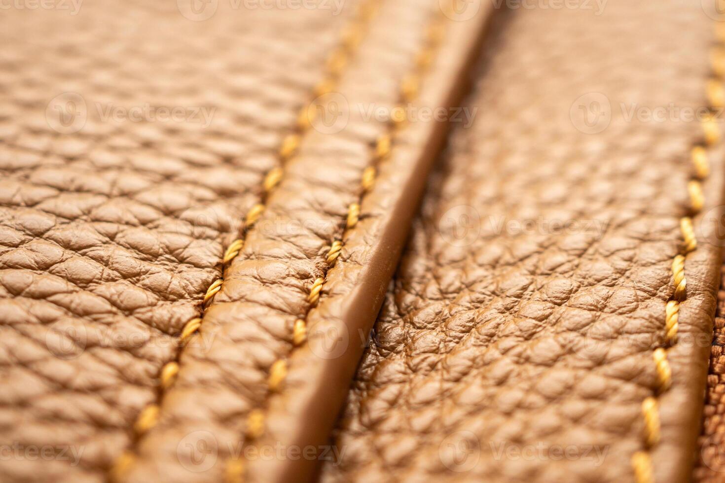luxury brown leather bag texture background with stitching photo