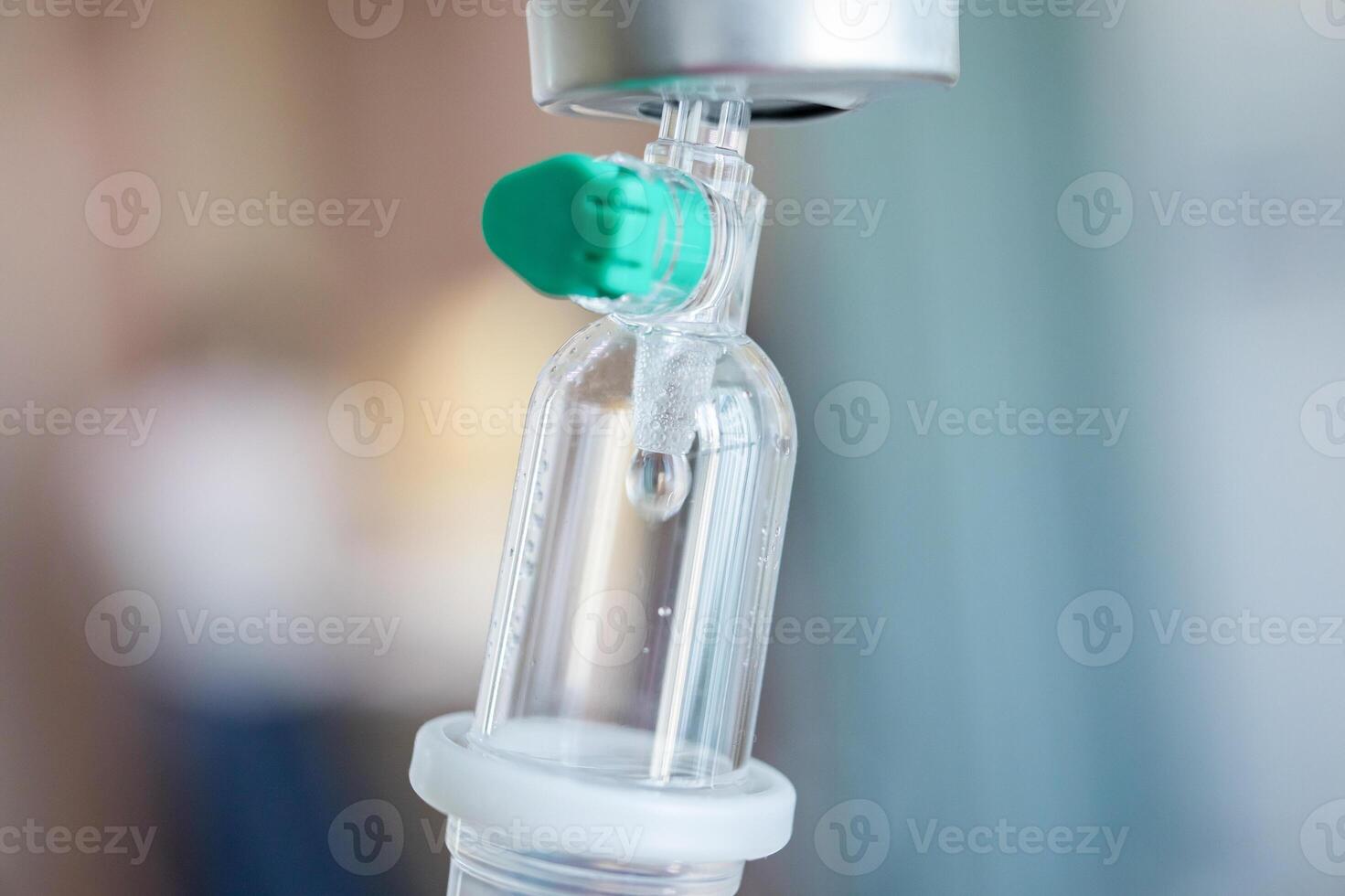 Close up medical intravenous IV drip in hospital background photo