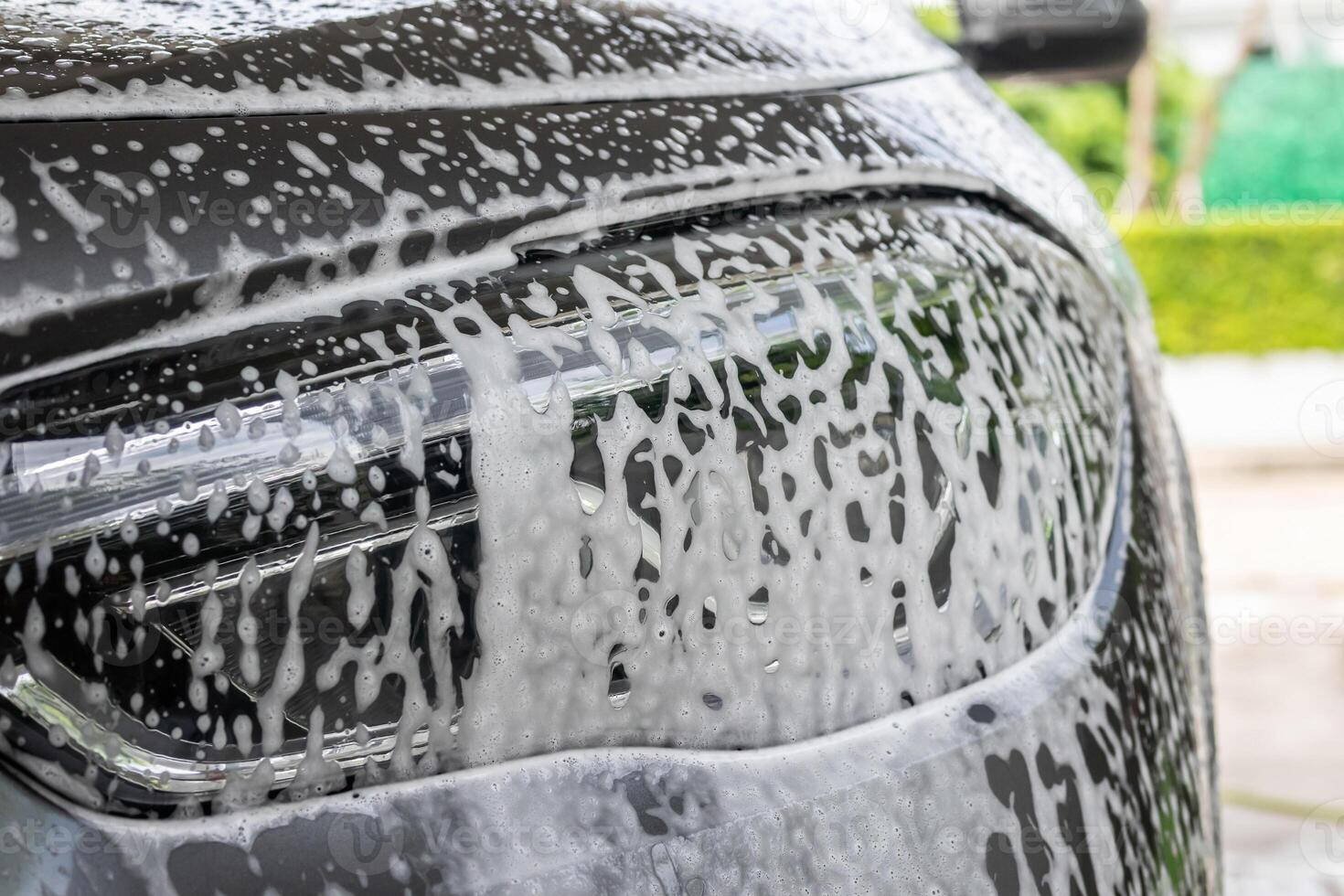 car cleaning and washing with foam soap photo