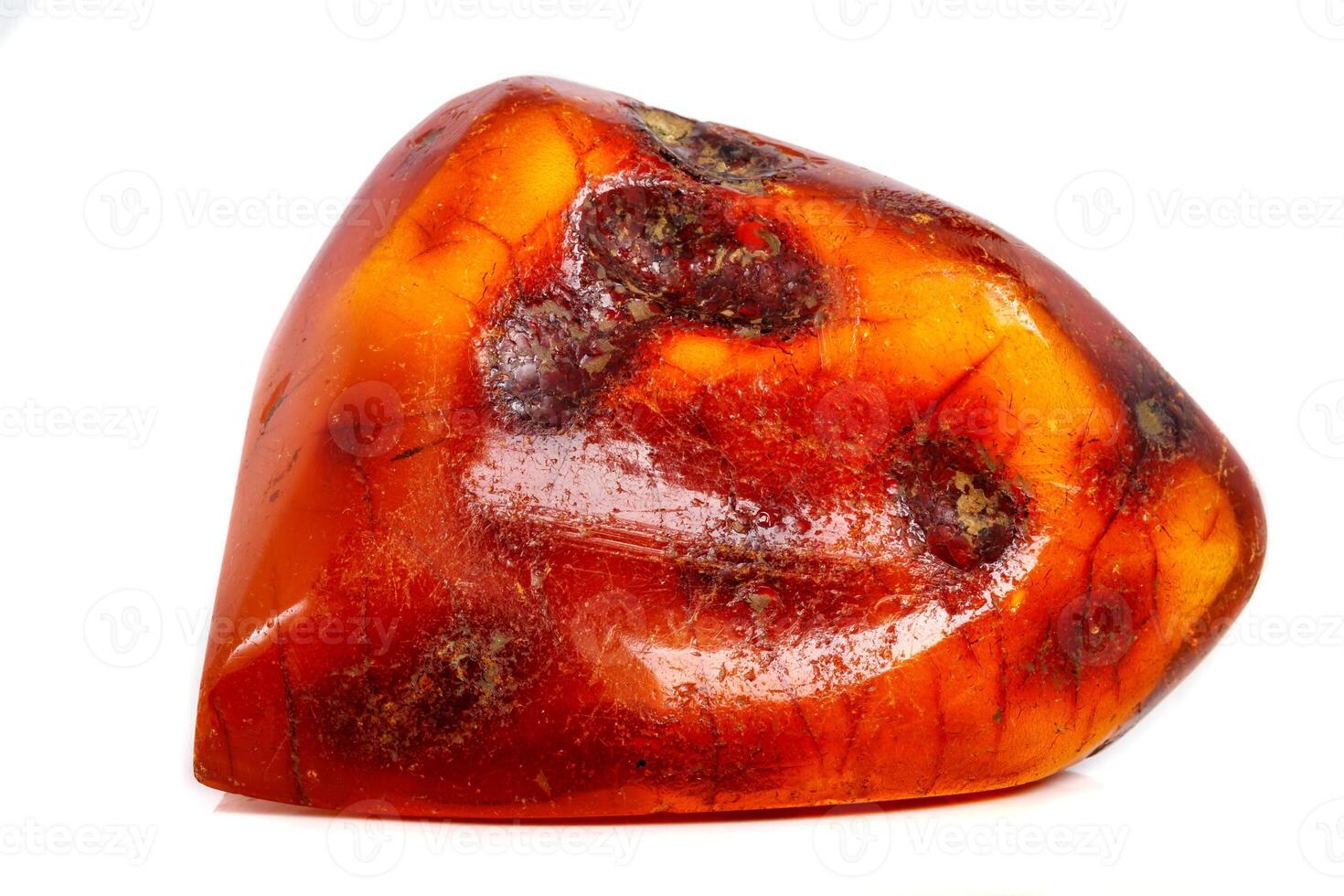 Macro Amber mineral stone on white background photo