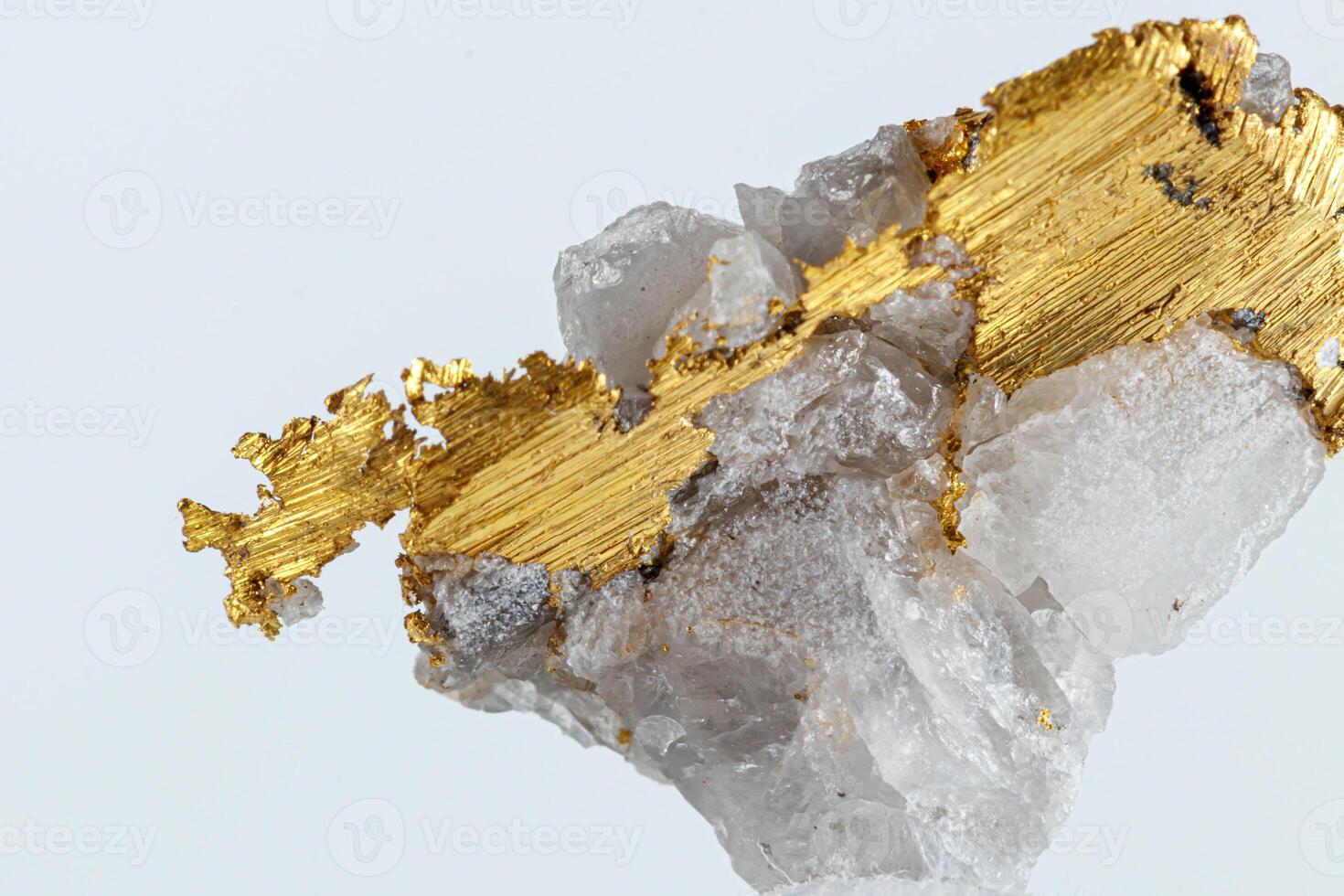 macro mineral stone metal gold in quartz on a white background photo