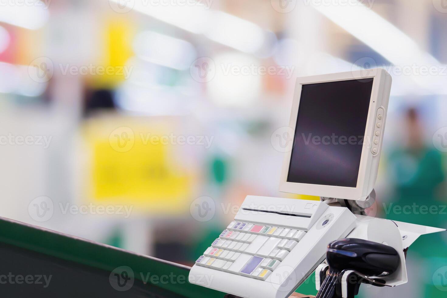 Empty cashier checkout desk with terminal in supermarket photo
