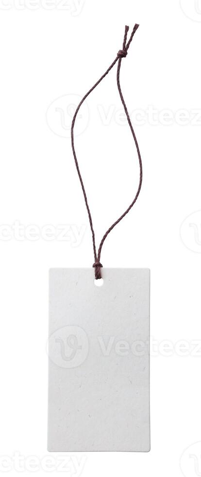 Blank price tag tied with string isolated on white background photo